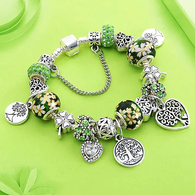 Braccialetto con albero della vita e perline di cristallo verde, elegante accessorio in argento tibetano.