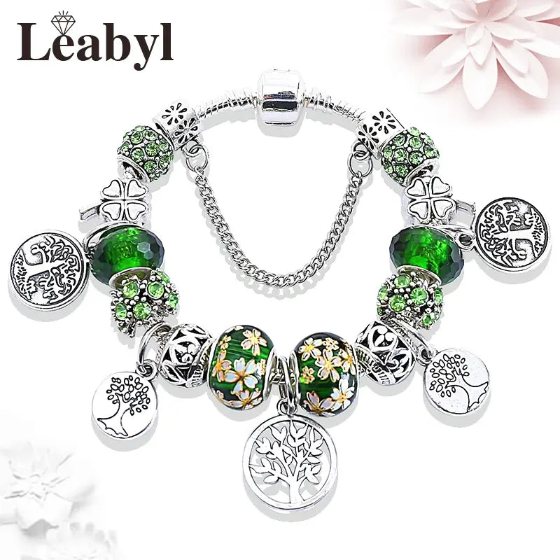 Braccialetto con albero della vita e perline di cristallo verde, elegante accessorio in argento tibetano.