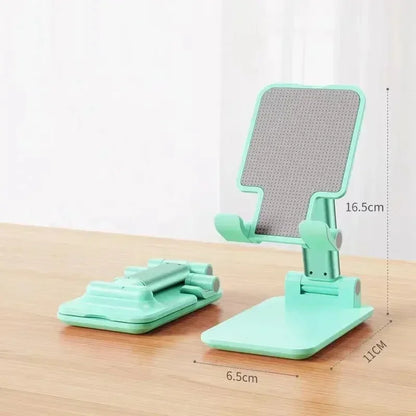 The "Foldable Mobile Phone Holder Stand" is a versatile, adjustable stand for phones and tablets, ideal for use on a desk or table. | Vilemo