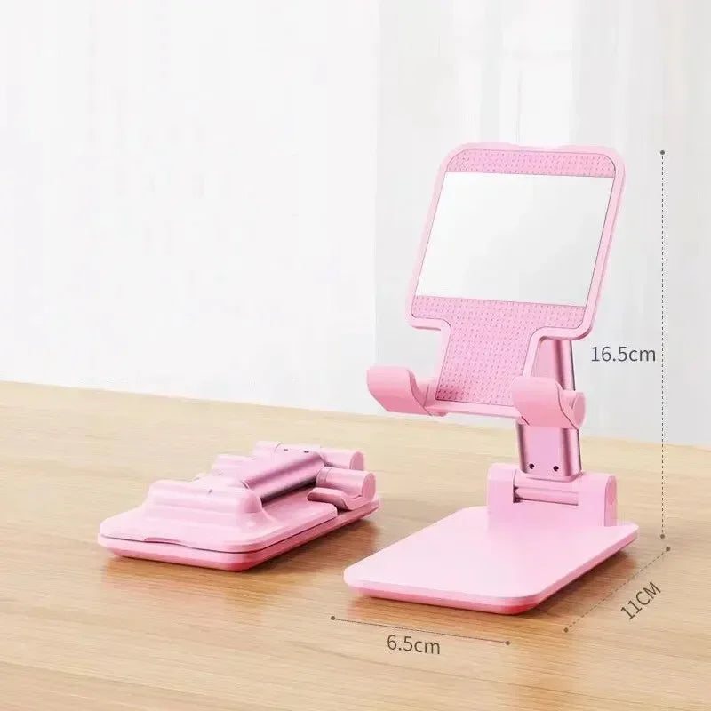 The "Foldable Mobile Phone Holder Stand" is a versatile, adjustable stand for phones and tablets, ideal for use on a desk or table. | Vilemo